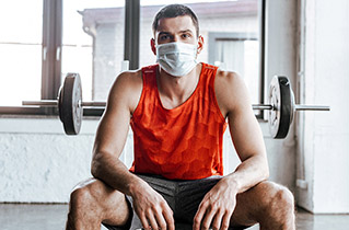 man wearing mask at gym