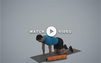 man on his hands and knees with a foam roller