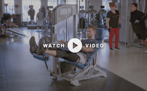 man doing a seated leg curl