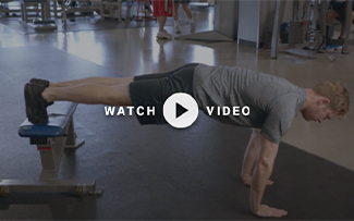 man performing a decline push up