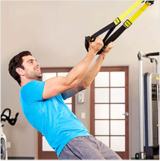 a man doing trx bicep curls