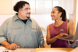 Female trainer with male client in the kitchen