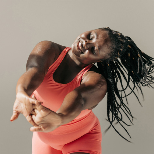 A lady dancing with her arms out