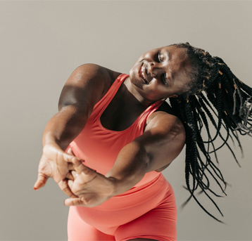 A lady dancing with her arms out