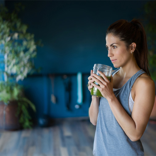 A woman drinking a shake