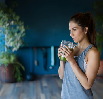 A woman drinking a shake