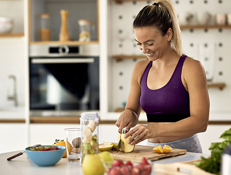 a woman eating nutritious for a healthy bmi