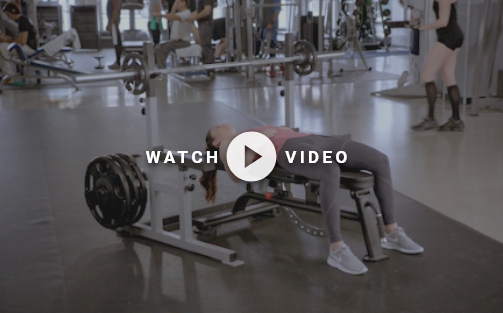 woman using a weight bench