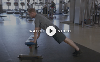 man performing an incline pushup