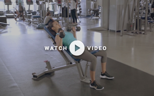 woman using dumbbells