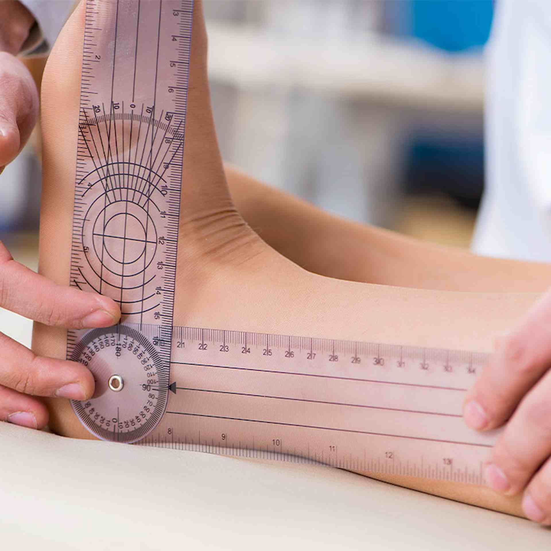 Goniometric tool being used on ankle joint