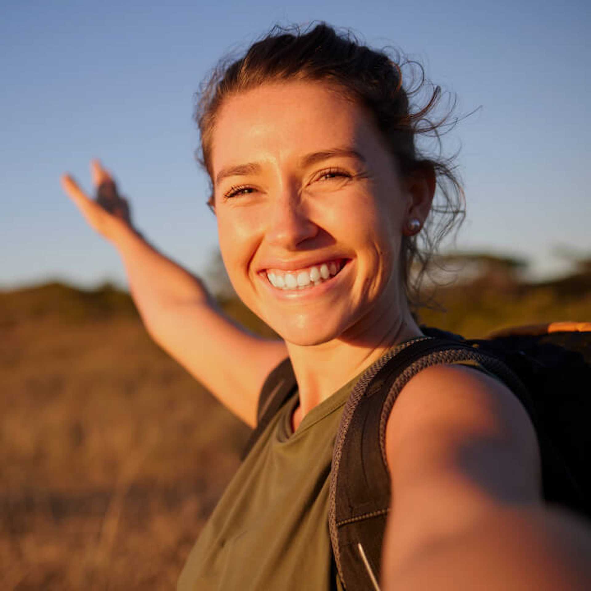 Female outside smiling at camera