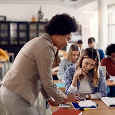 A teacher helping a student