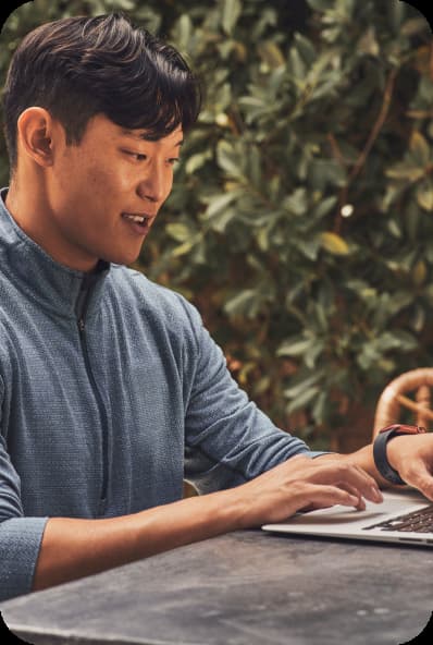A man typing on a laptop