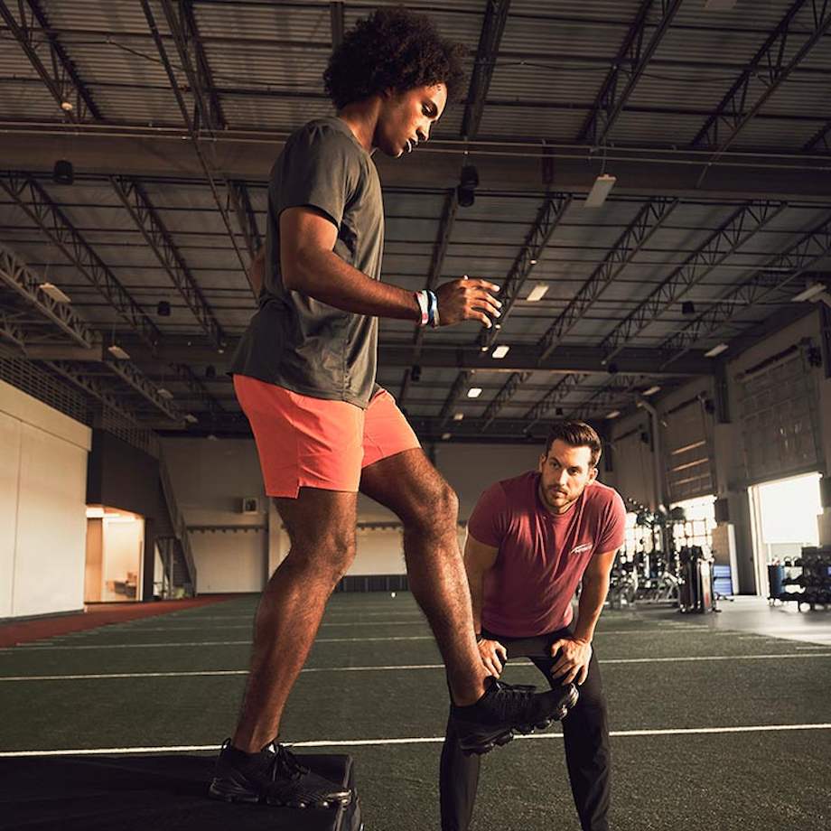 Male NASM trainer doing a box assessment with male athlete