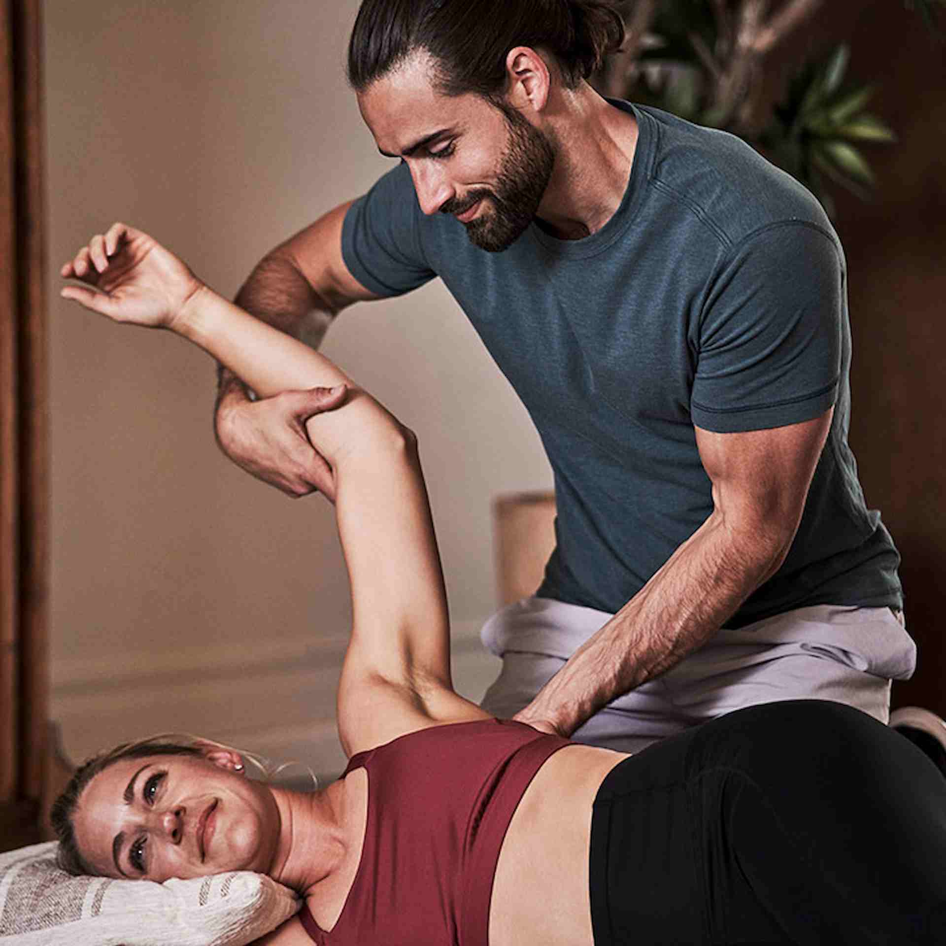 Stretching Coach helping female client on on stretch