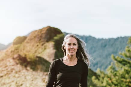 A woman hikes in the mountains