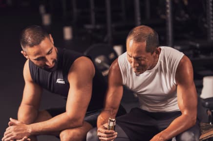 Female and male NASM trainers posing towards camera