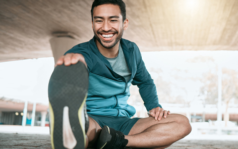 MAN stretching and smiling