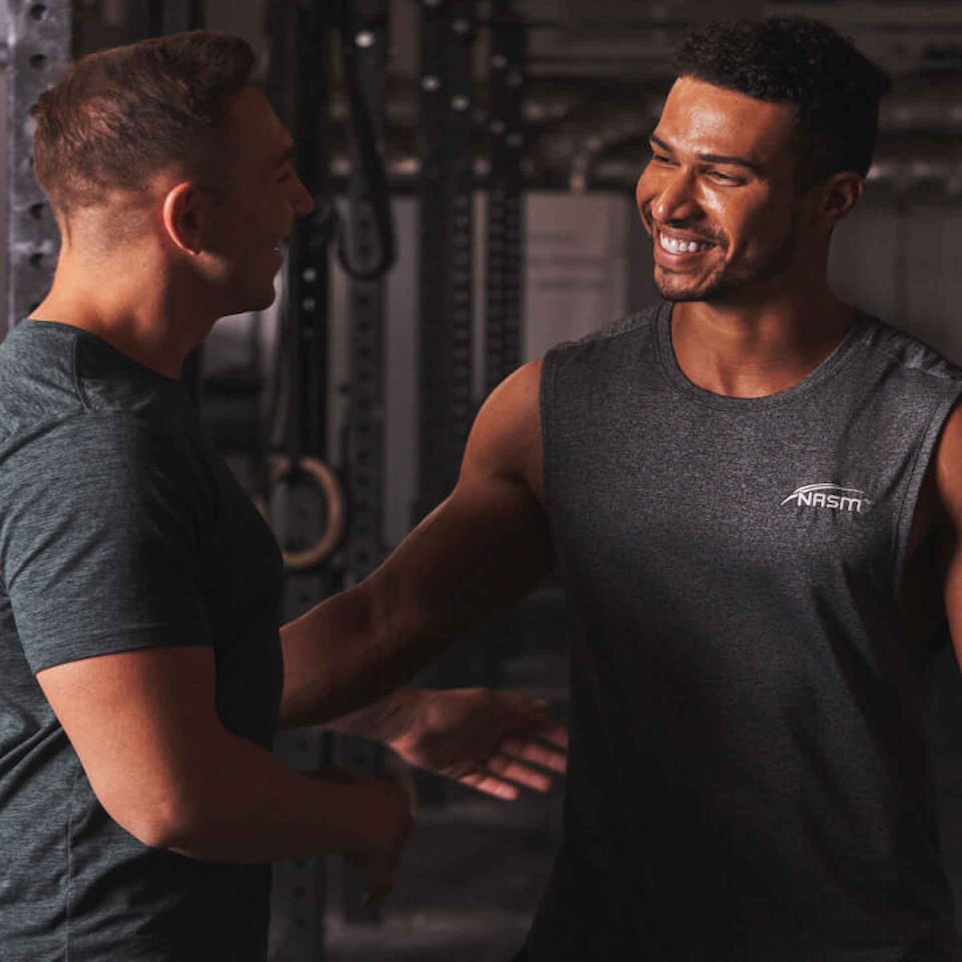 Two males talking in the gym