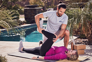 Coach stretching client
