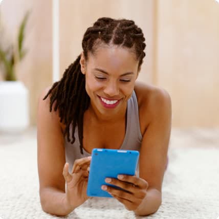 A woman looking at a tablet