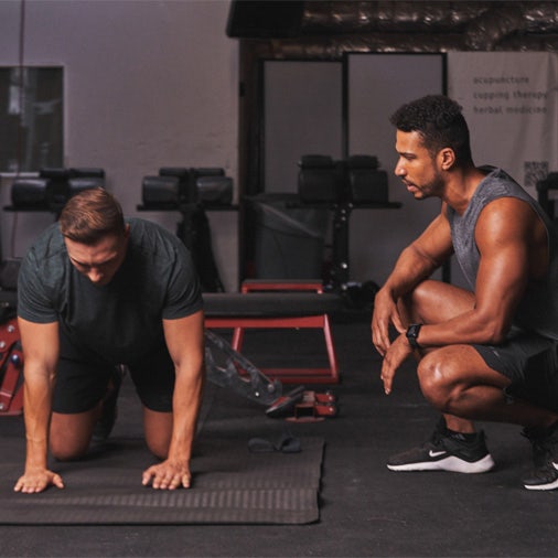Two men working out in the gym
