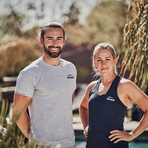 a man and woman standing outside
