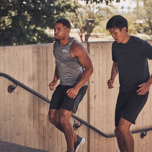 two men running up stairs