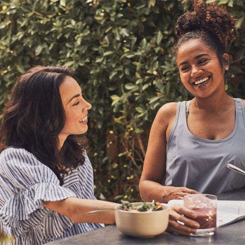 two women making a salad
