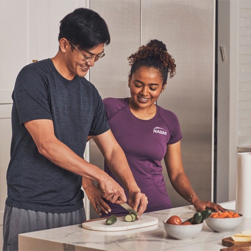 Woman and man making food in the kitchen