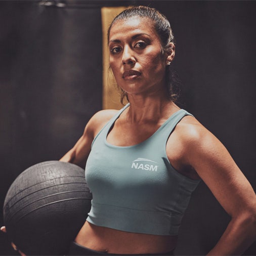 Woman holding a medicine ball