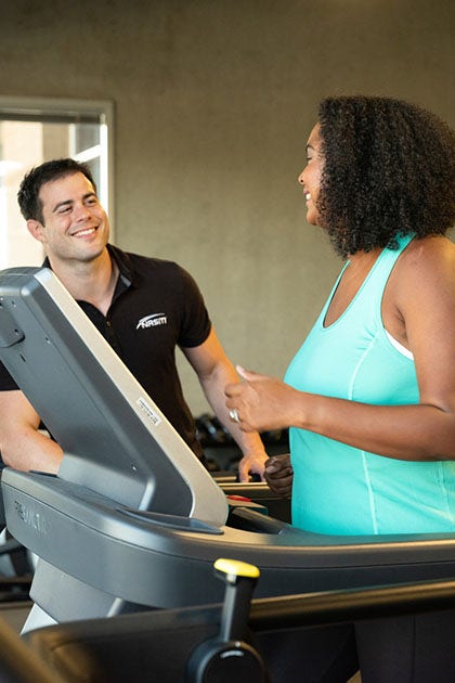 personal-trainer and client on treadmill