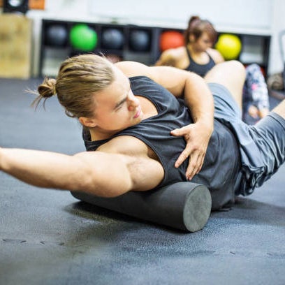 Man foam rolling
